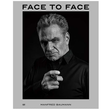 Book cover of 'Face to Face' by Manfred Baumann with a black and white portrait of a man.